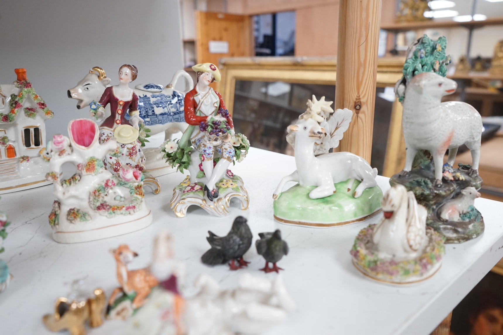 A mixed group of English and Continental ceramic models including miniature figures, pots and jugs, tallest figurine - 10.5cm. Condition- variable